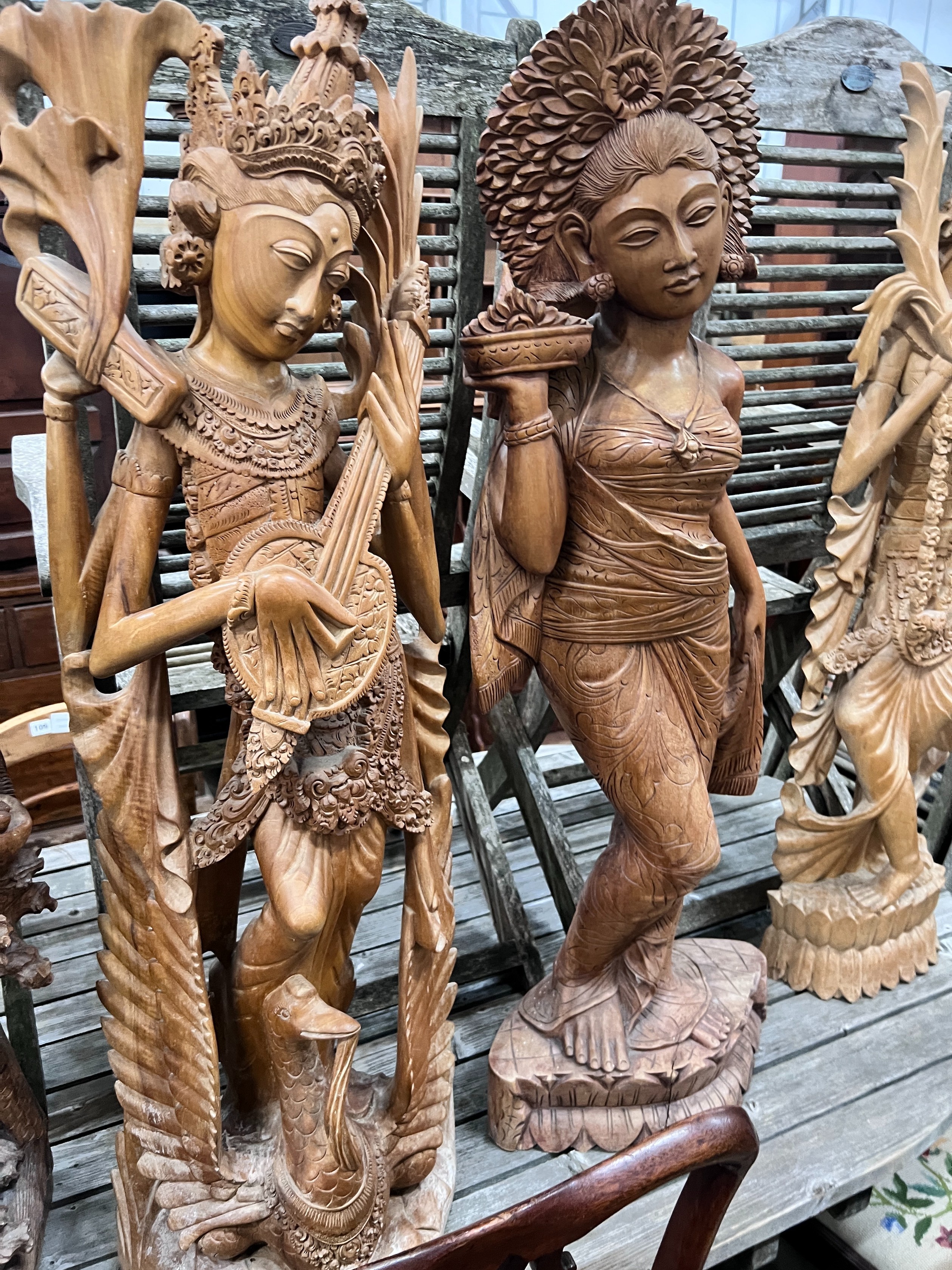 Six Balinese carved hardwood figures, largest height 104cm *Please note the sale commences at 9am.